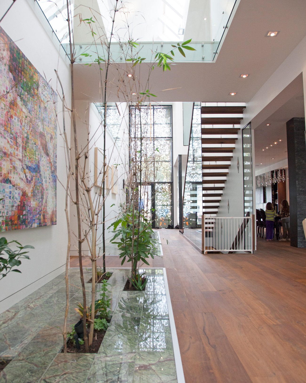 Antonio Tadrissi Interior garden ideas - Green marble surrounds bamboo shoots - Prototype Design Lab