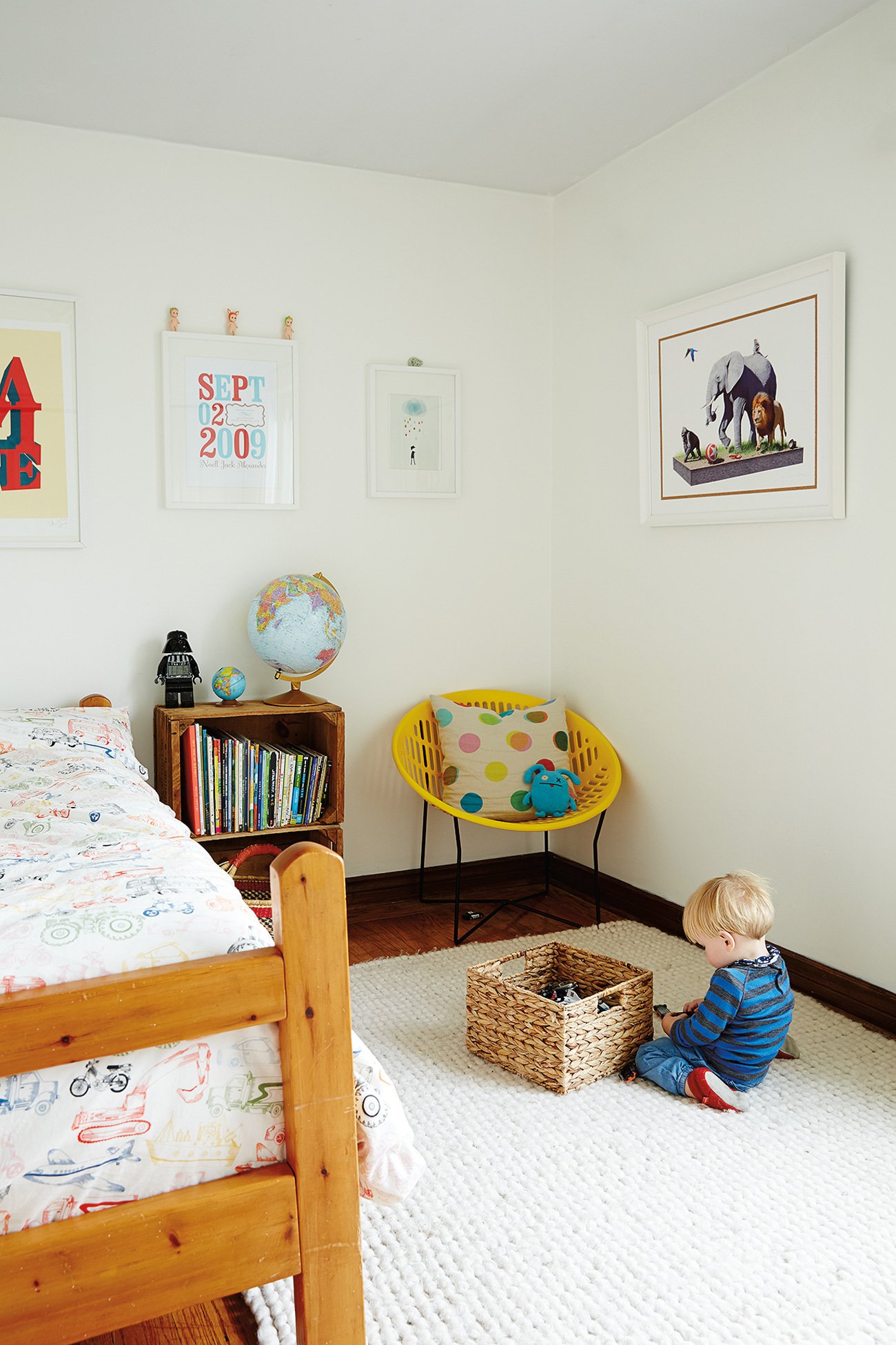 Kid playing in his bedroom with toys