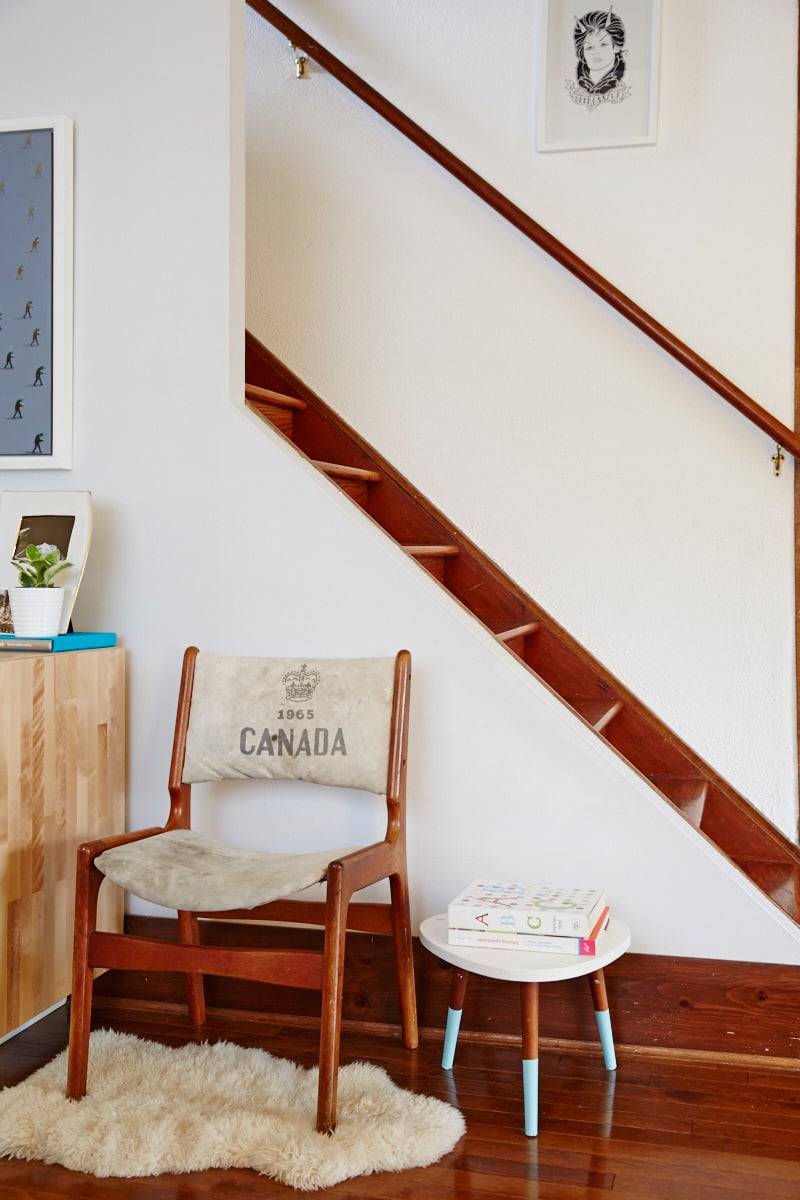 curate vintage decor - teak Scandinavian chair reupholstered with a vintage Canada Post bag