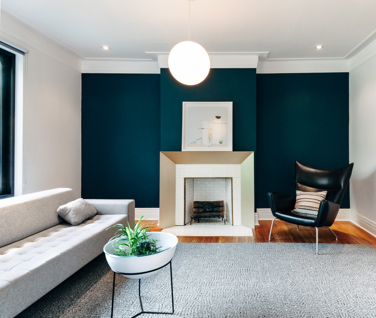 living room with couch, area rug and chair around fireplace, Renovated Edwardian home