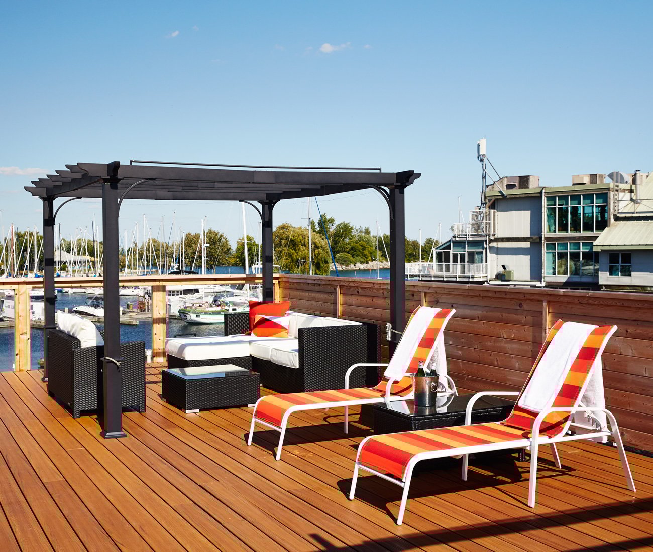 boat deck with patio furniture on one of the floating homes at the Toronto Marina