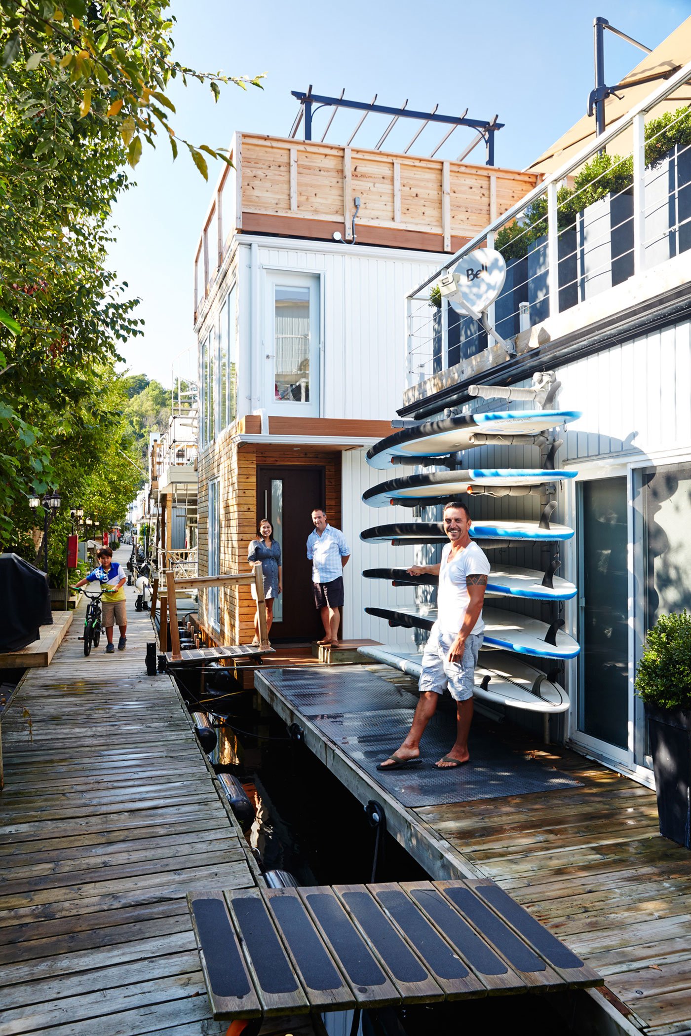 A boardwalk lined with mailboxes and bbqs leads to the Bluffer’s Park Marina parking lot, restaurant and snack shack.