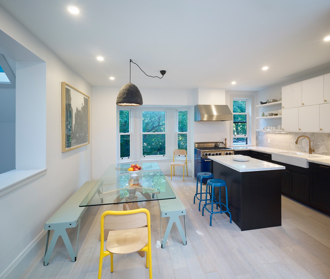 Heritage home renovation featuring a redesigned kitchen with removed wall, enlarged windows
