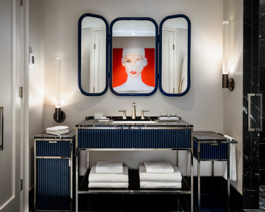 Brushed nickel sink with custom vanity in Bisha Hotel bathroom design by Studio Munge