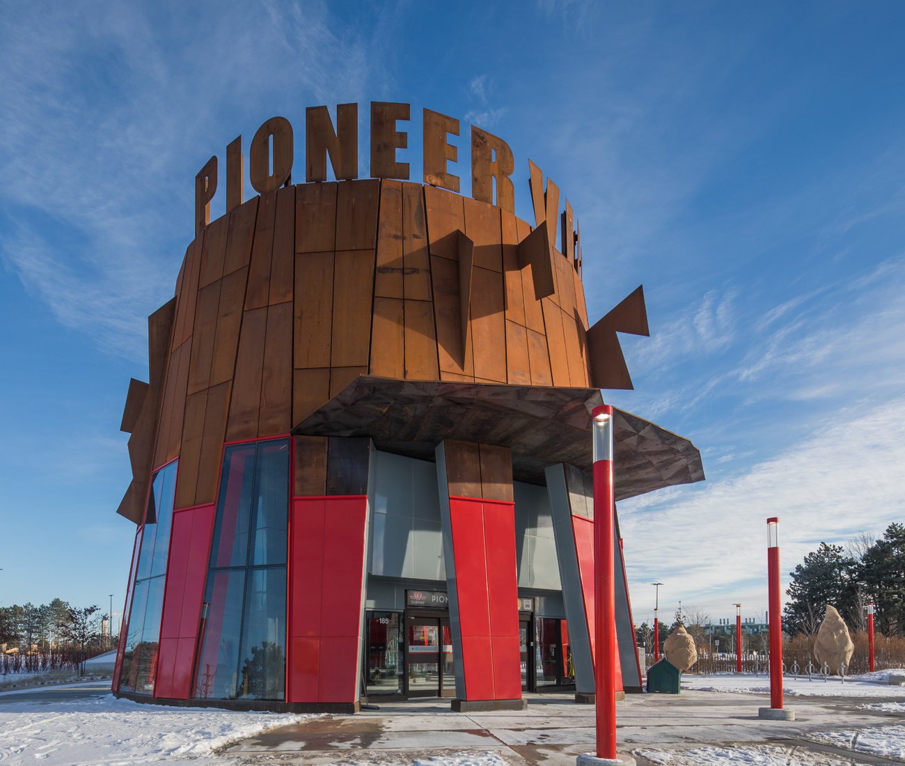 Corten fins protrude from one of the entrance of the Pioneer Village Station designed by Will Alsop