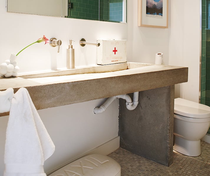 bathroom with custom-made poured concrete vanity