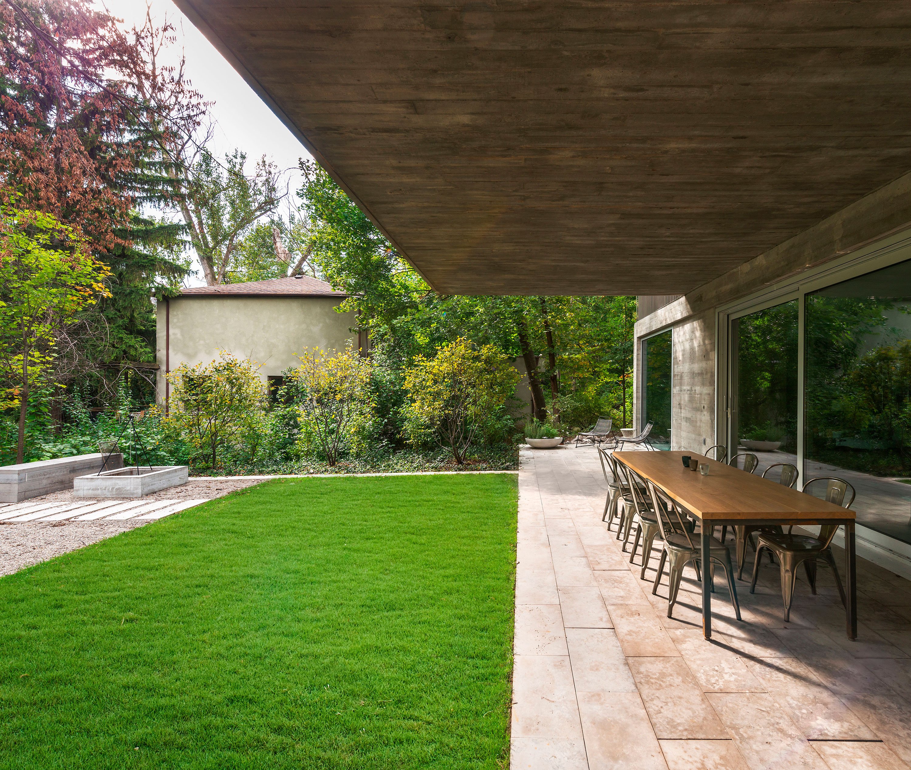 Outdoor landing connecting a cantilever home to a lush yard and Don Valley ravine.