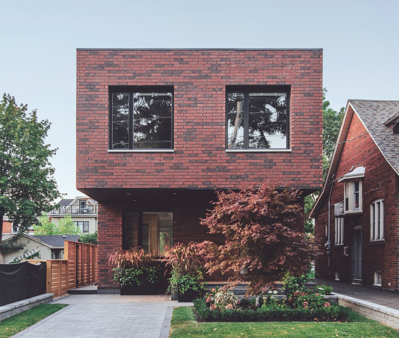 modern brick houses - Gabriel Fain Architects Brick Cantilever Home Toronto