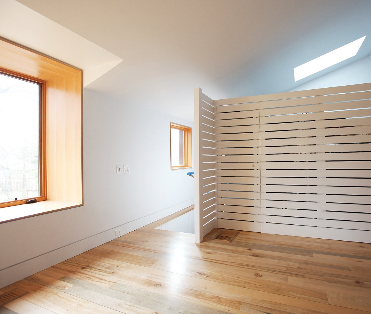 The Practice of Everyday Design Eden House Mississauga Designlines Magazine Bungalow Addition bathroom and storage area are concealed by a partition