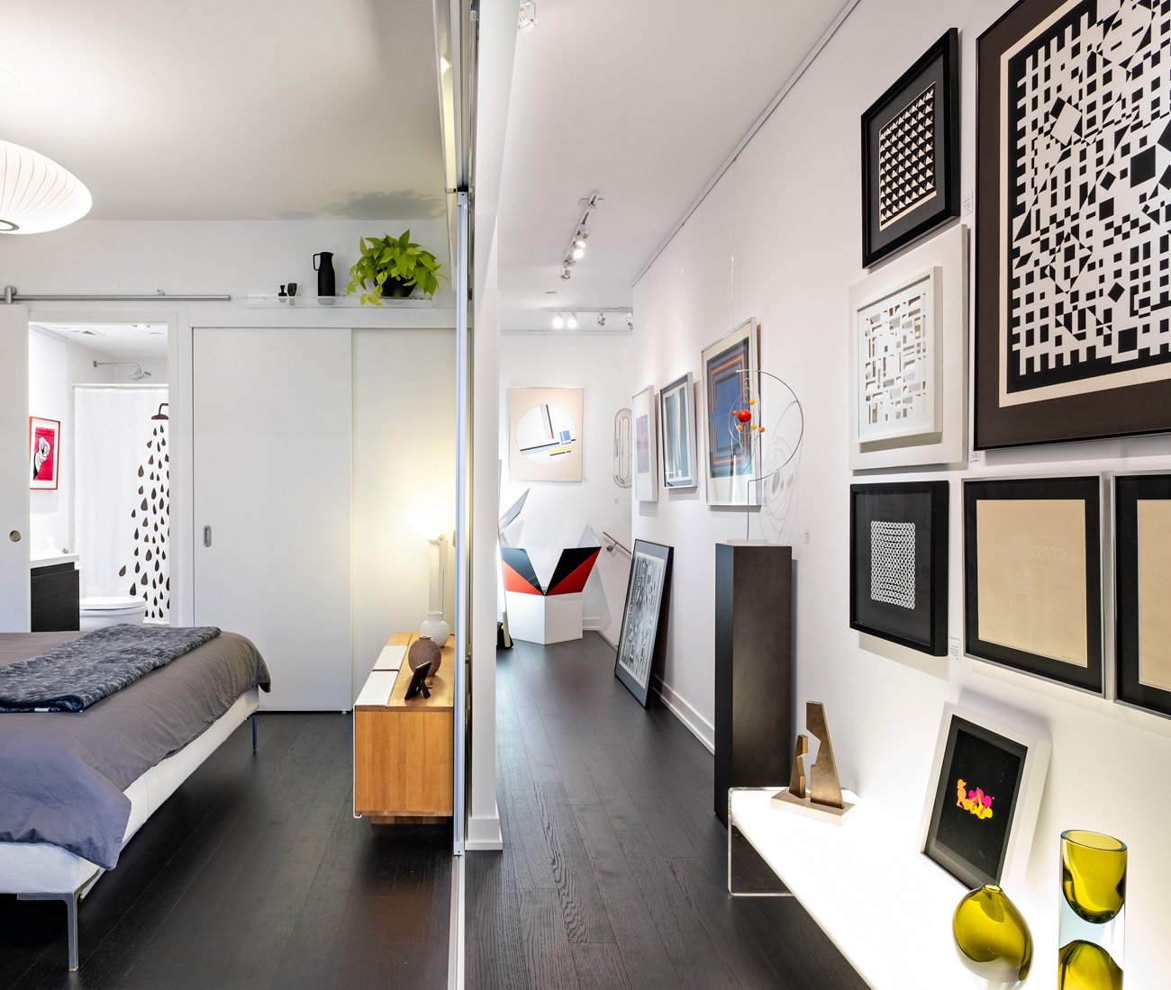 Atomic Design Toronto Lawrence Blairs Condo Designlines Magazine Atomic Design Condo - Glass pocket doors separate the bedroom from the living room and hallway.