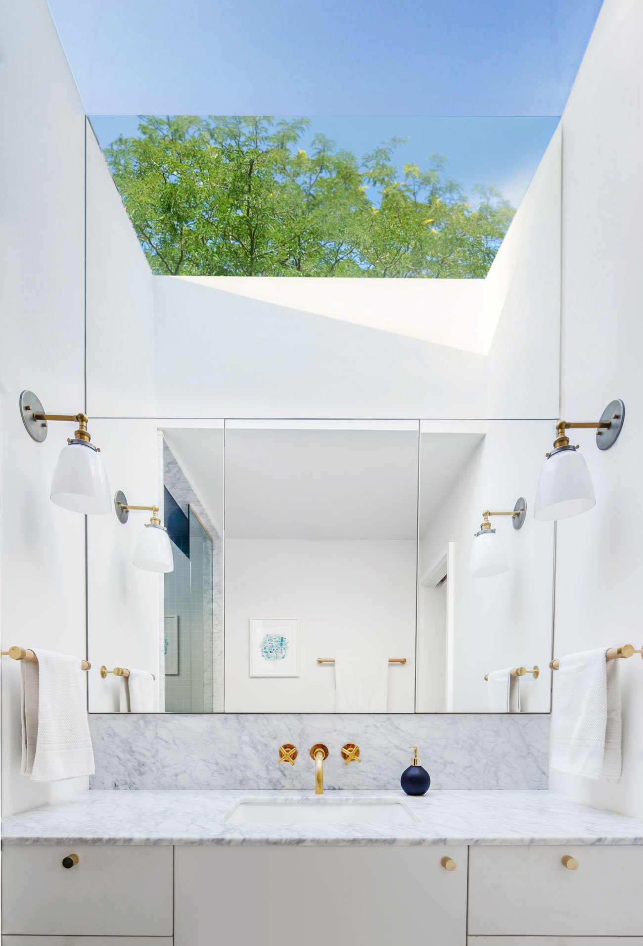 Bright Powder Room with a skylight