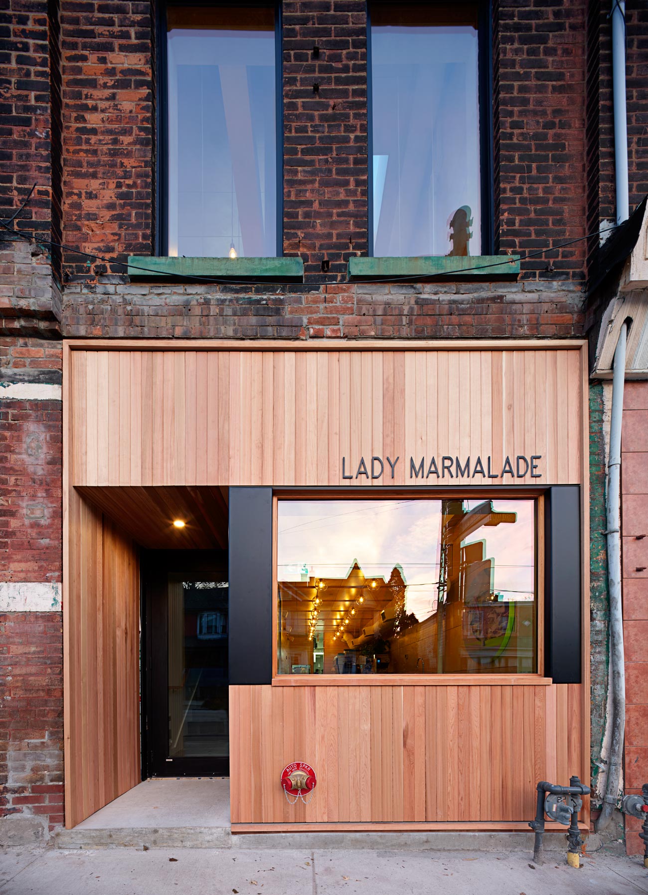 Cedar cladding at entrance of restaurant Lady Marmalade - Omar Gandhi architect