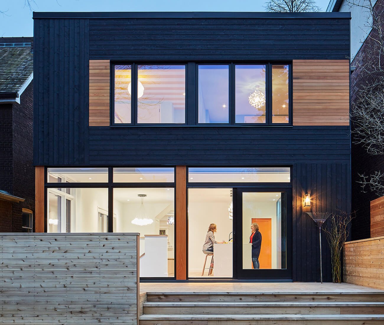 Building exterior with Black wood siding, design by Heather Asquith architect - Julie Reinhart interior designer