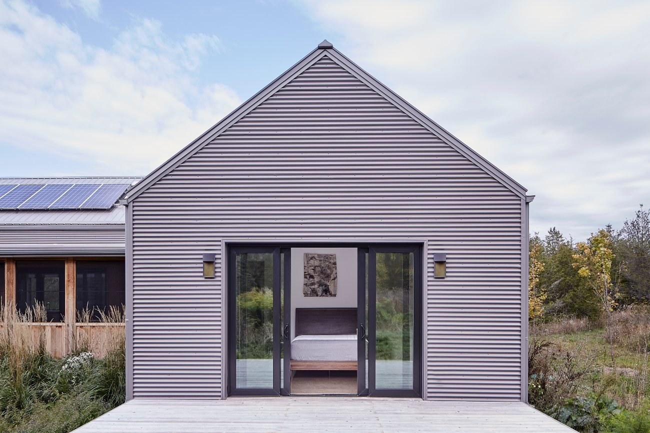 build exterior of an off grid Farmhouse in Prince Edward County, Ontario