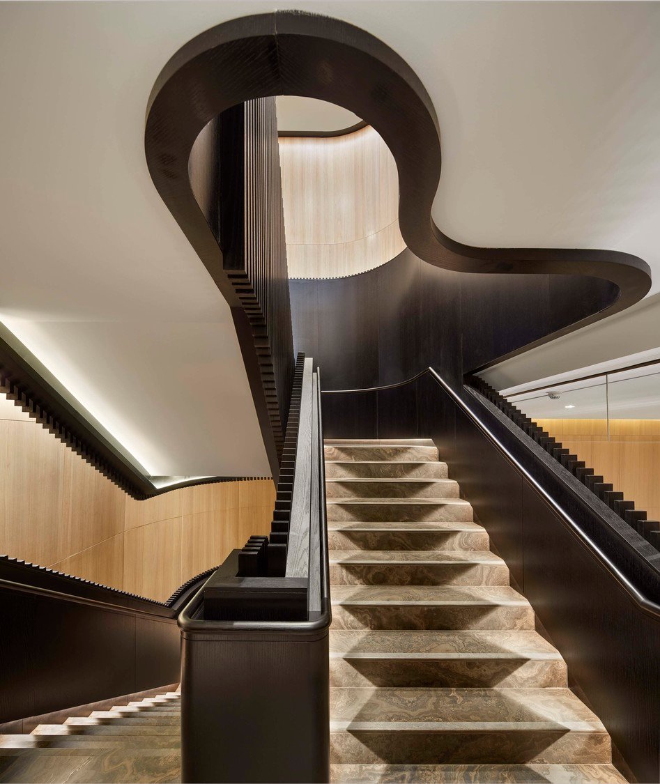black feature staircase leading up to the second-storey hotel ballroom