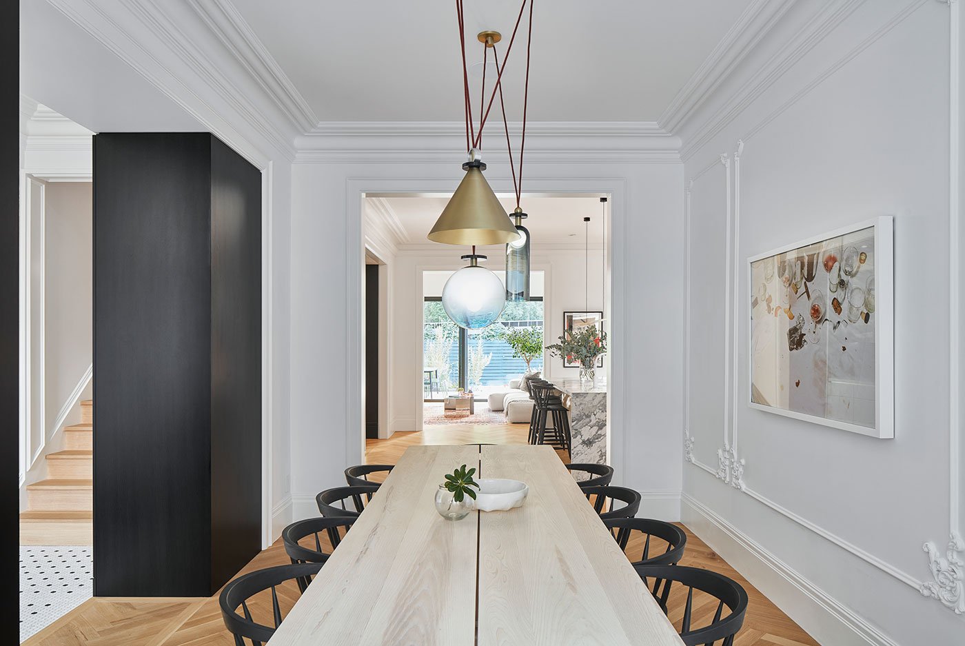 Dining table with light pendant on top. Interview with Gloria Apostolou & Jennifer Kominek