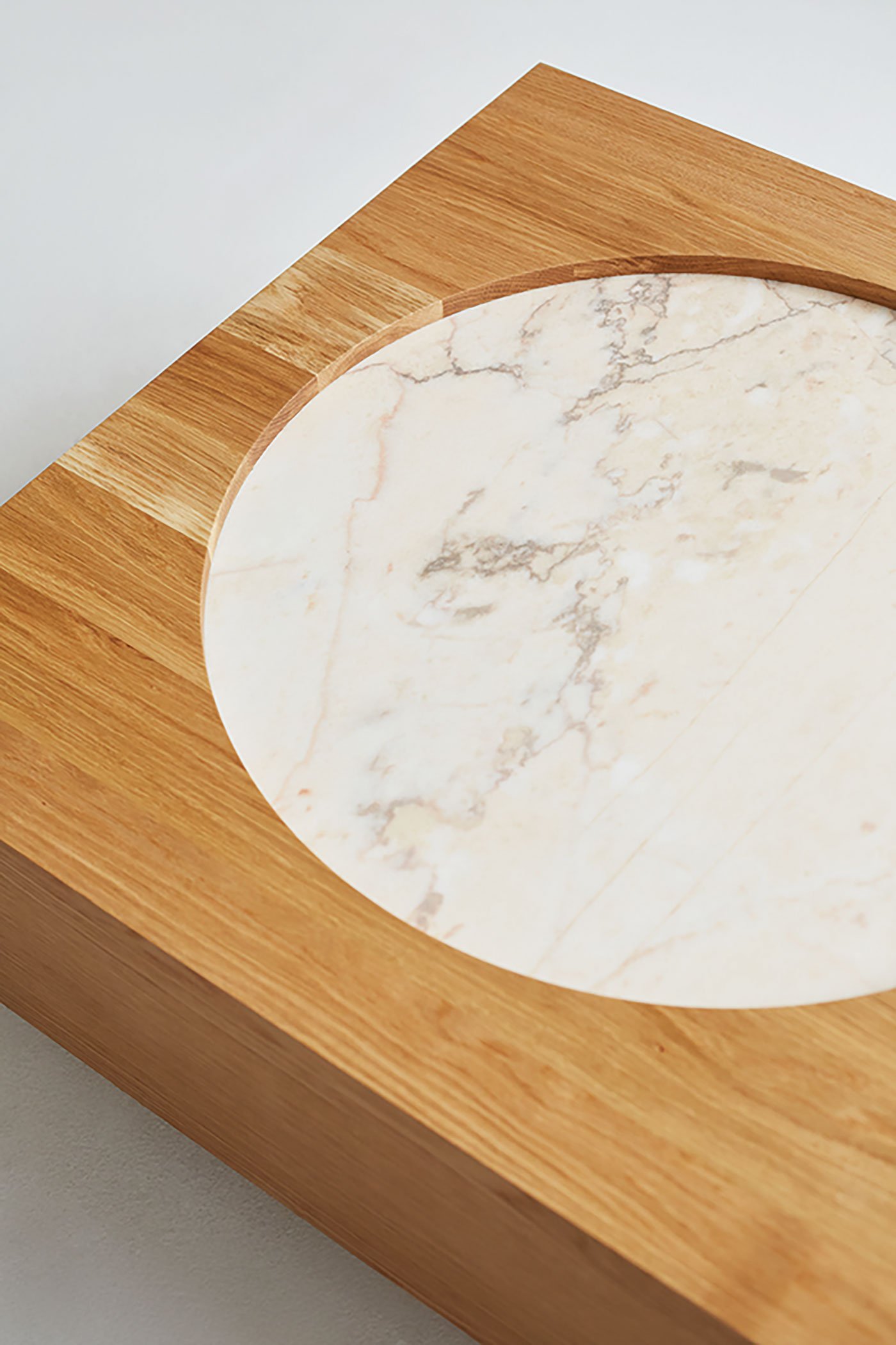 white oak accented with marble, the M.R.S. collection’s Coffee Table