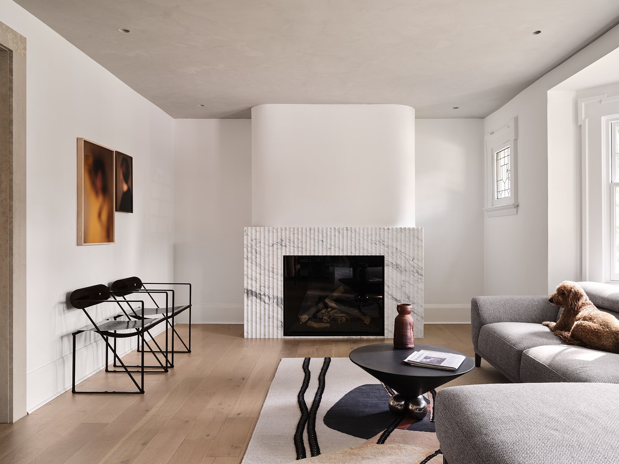 fireplace cladded with fluted calacatta vagli marble