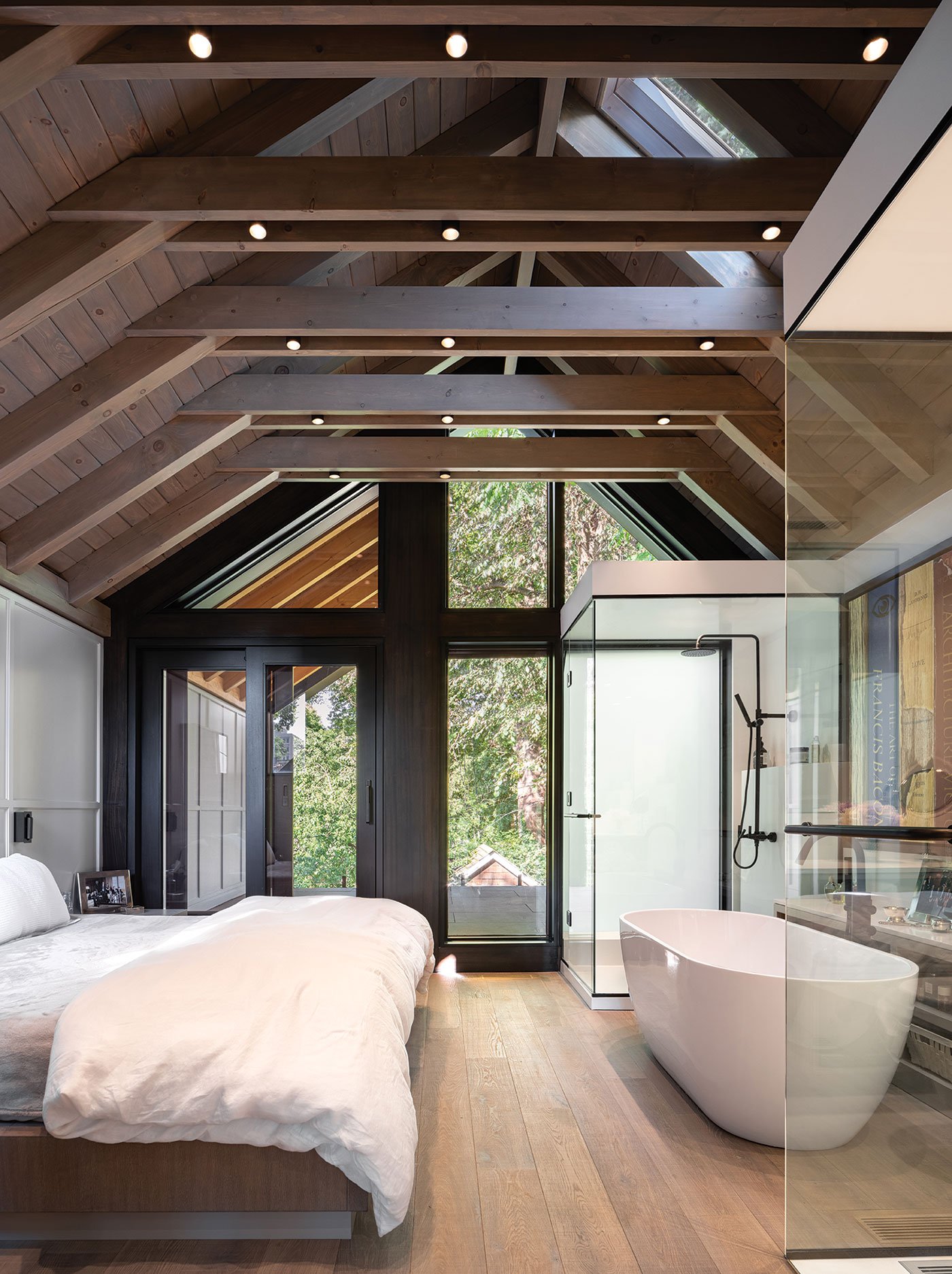 Wide-plank engineered white oak flooring runs throughout the garden suite