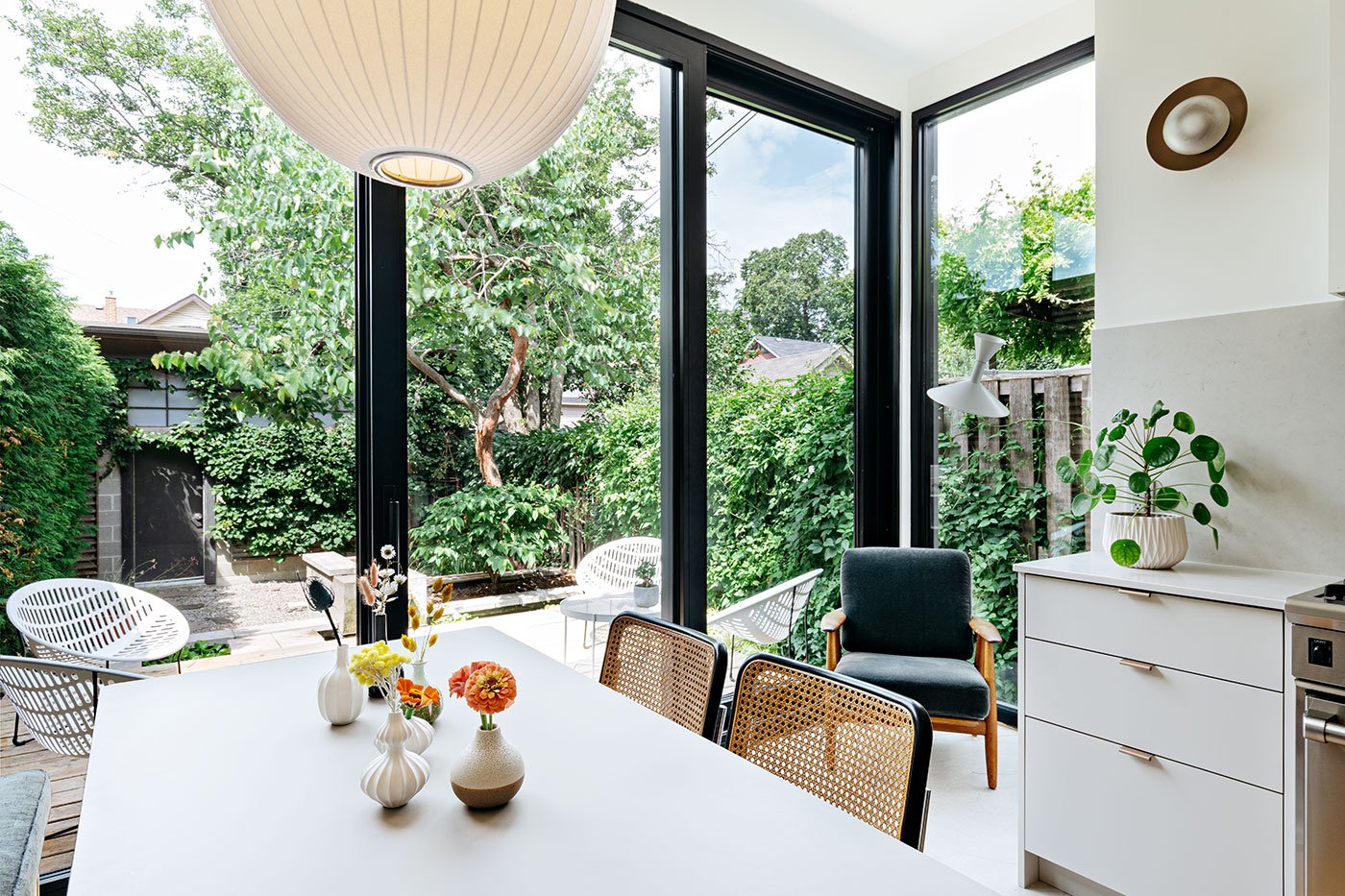 The new patio doors create a glassed-in reading nook. Cabinet pulls, Etsy; pendant, EQ3.