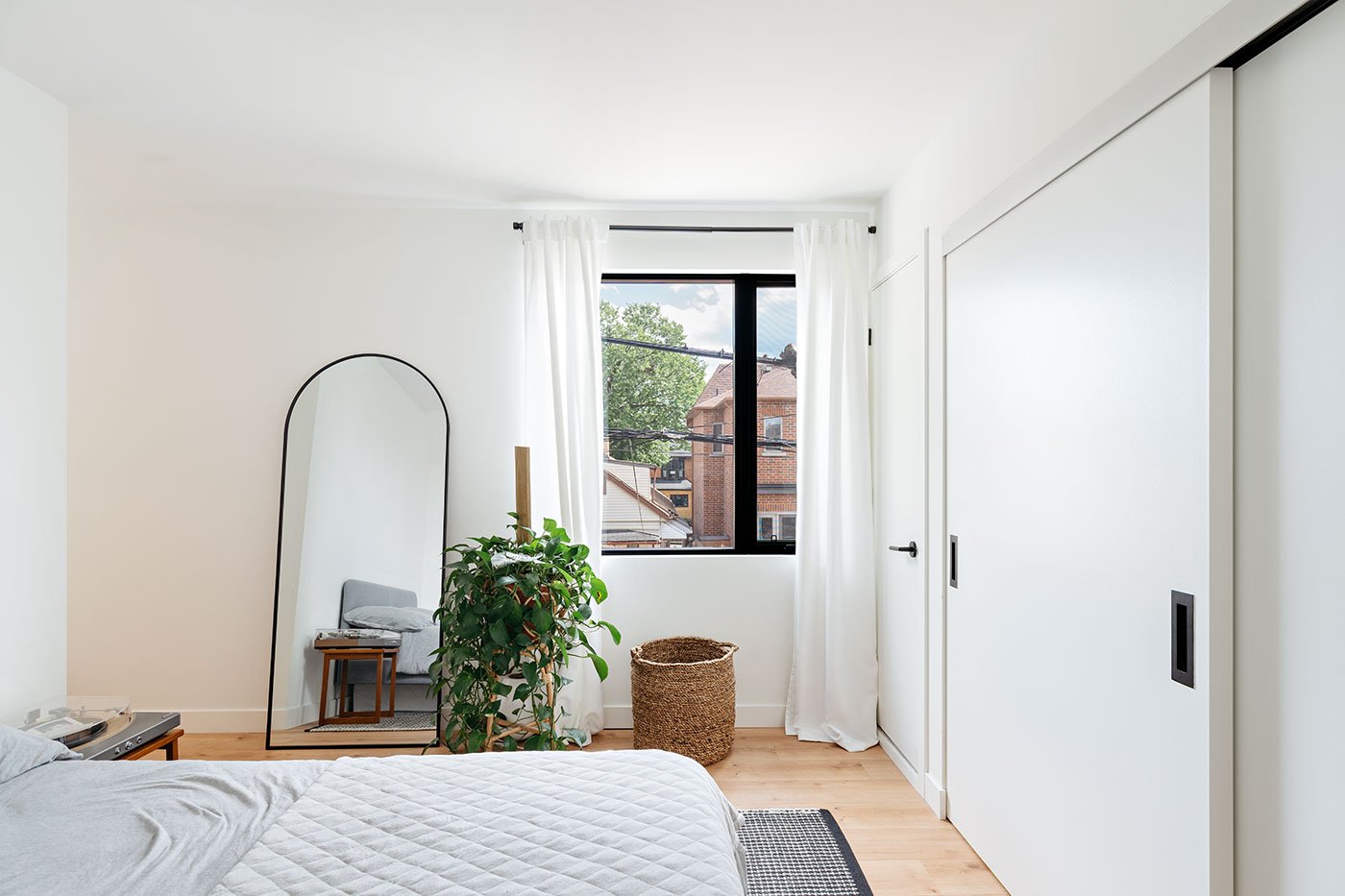 Amply sized bedroom with an office (or crib) nook and the principal bathroom.