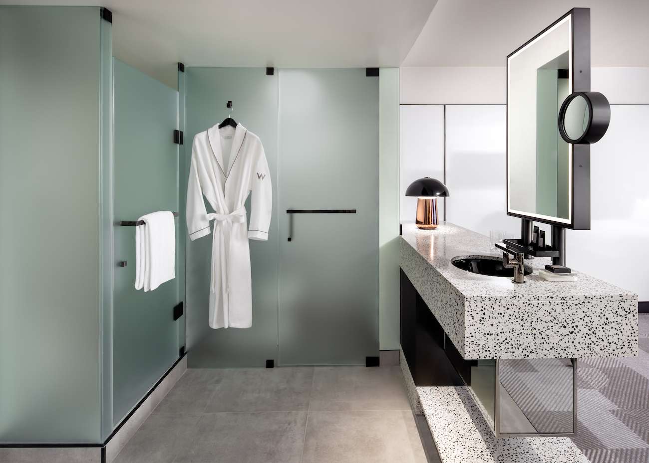 Guest room details include a bathroom sink and a wardrobe featuring the Montreal hotel logo.