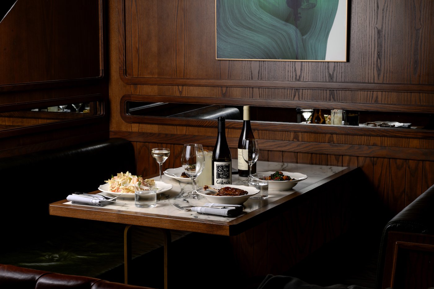 A restaurant table prepared with delicious food.