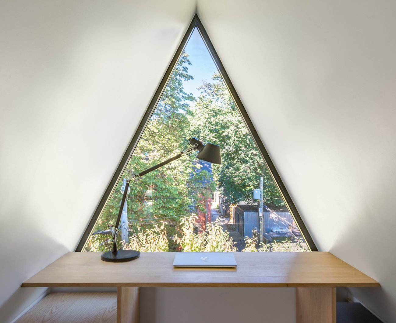 triangular window in the peak of the roof