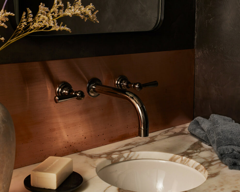 Vintage piece of Calacatta repurposed into the powder room vanity.